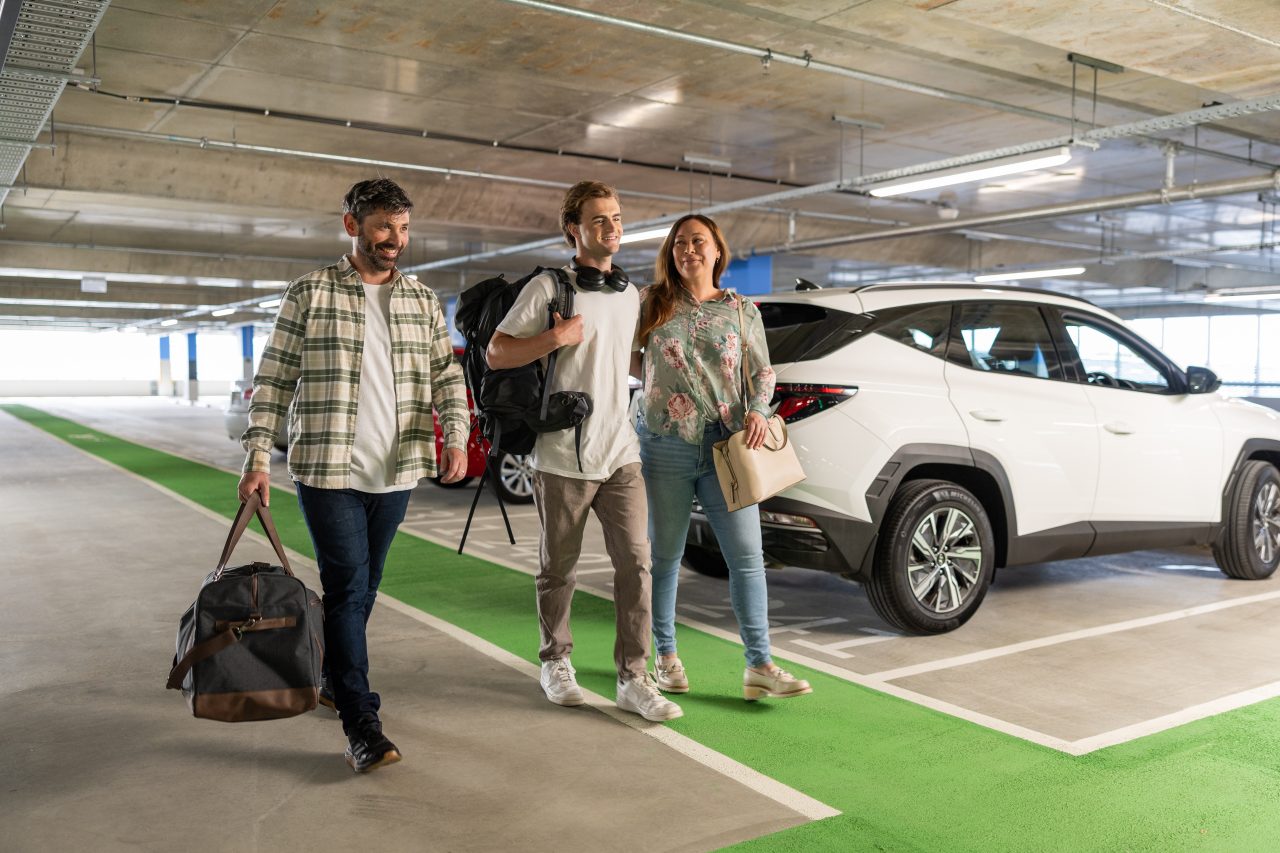 family walking in a car park